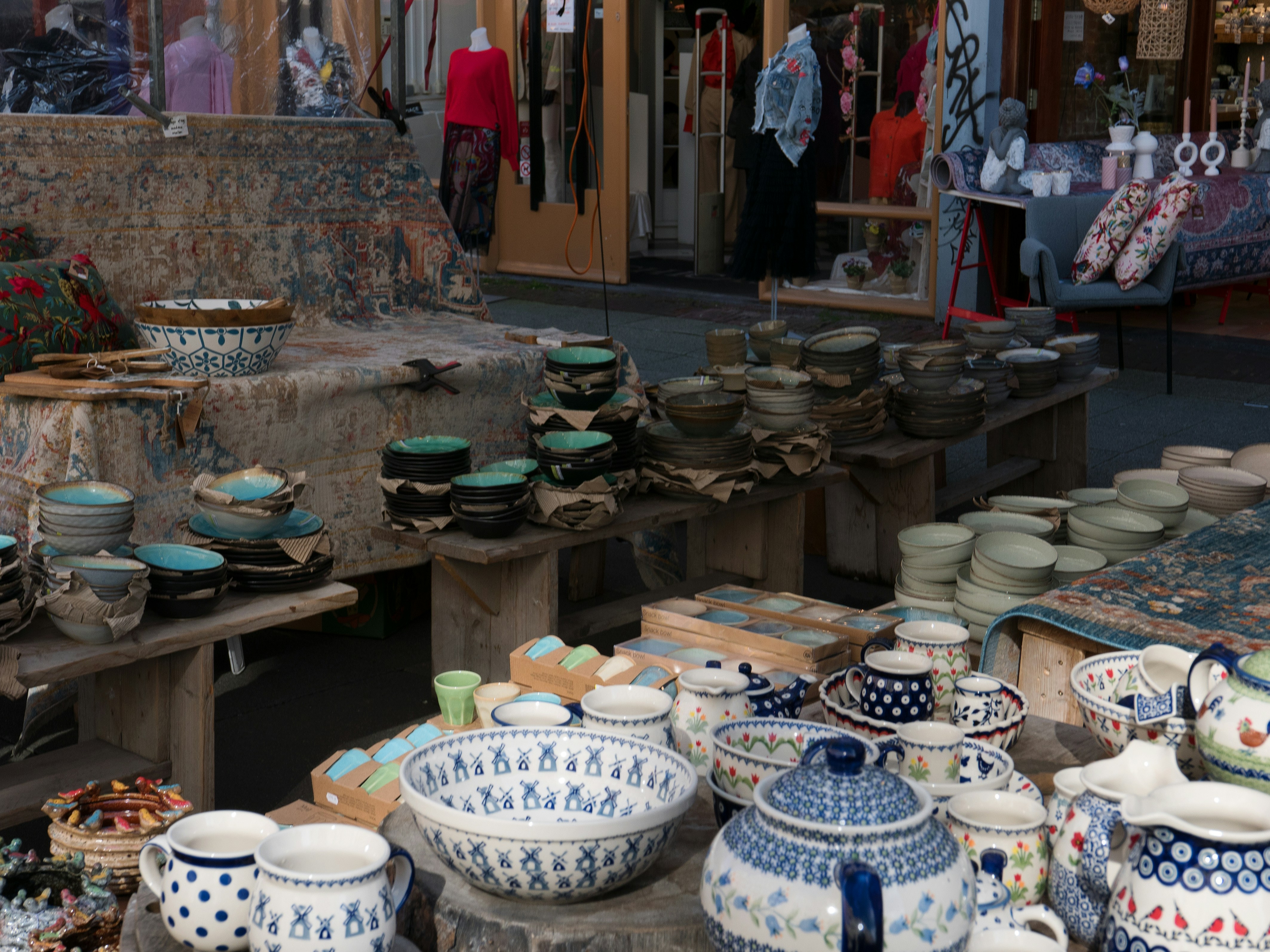A table topped with lots of artistic bowls